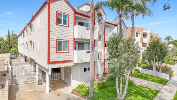 Villa Virginia Apartment gated parking and front view of complex thumbnail